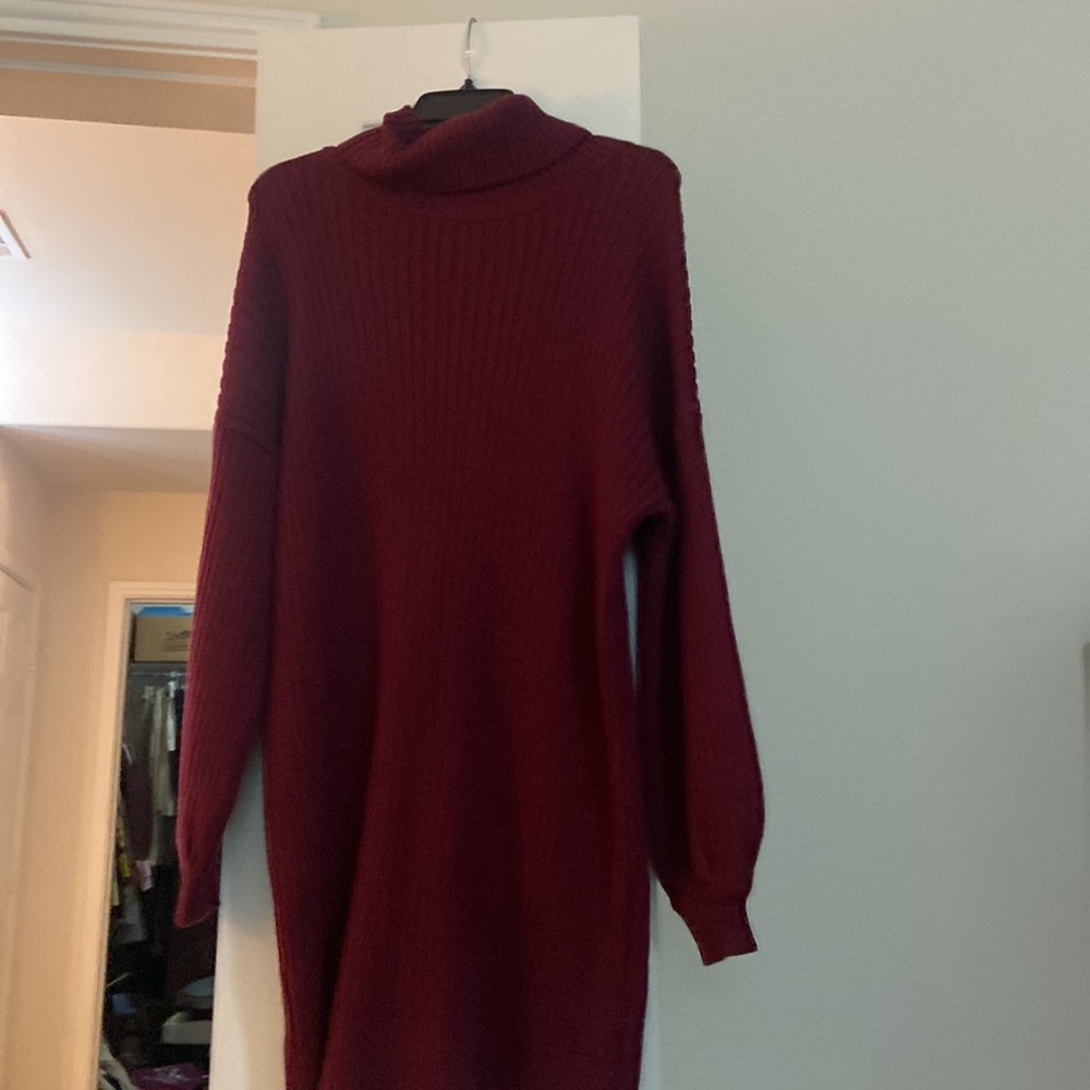 Size L Wine colored turtle neck sweater dress with gathered sleeve detail.